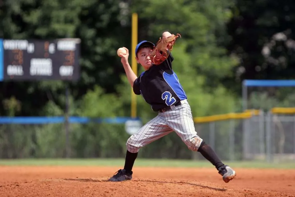 Youth pitcher developing mechanics